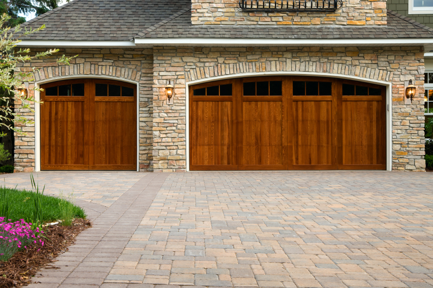 Pavers, custom doors, and stone on custom home.