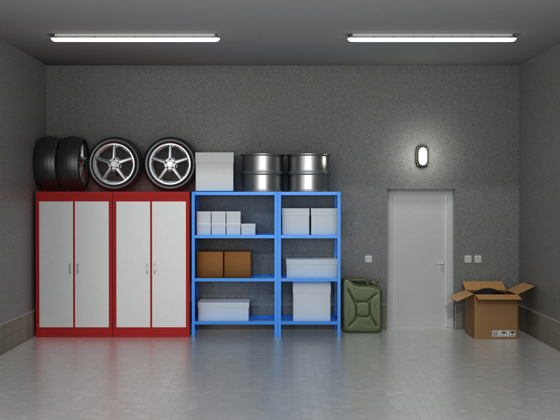 The interior suburban garage with wheels and boxes.